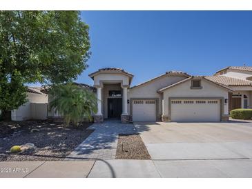 Charming single-story home with a three-car garage and well-maintained landscaping at 797 E Cedar Dr, Chandler, AZ 85249