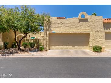 Charming home featuring desert landscaping, a two-car garage, and a textured stucco exterior at 1235 N Sunnyvale -- # 113, Mesa, AZ 85205