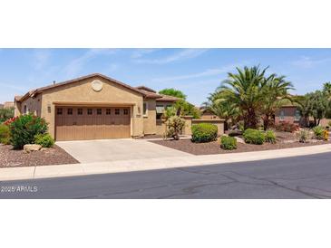Lovely single-story home featuring a two-car garage, desert landscaping, and a well-maintained yard at 27380 N 128Th Ln, Peoria, AZ 85383