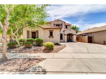 Charming stucco home featuring a terracotta tile roof and lush, mature landscaping at 3029 E Patrick St, Gilbert, AZ 85295