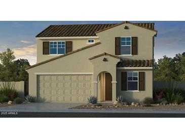 Charming two-story home with a tile roof, tan stucco, a two-car garage, and complementary brown shutters at 17620 W Georgia Ave, Litchfield Park, AZ 85340