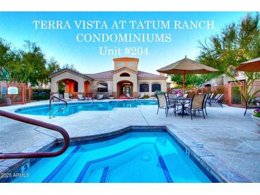 Community pool and spa for Terra Vista at Tatum Ranch Condominiums offers shaded tables and lounge chairs at 29606 N Tatum Blvd # 204, Cave Creek, AZ 85331