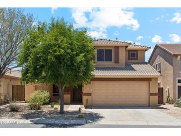Charming two-story home with a desert landscape, tile roof, and attached two-car garage at 4759 E Woburn Ln, Cave Creek, AZ 85331