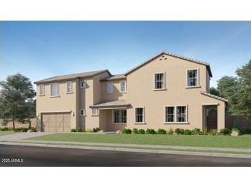 A tan, two-story home boasts a well-maintained yard and a classic architectural style at 10105 E Ulysses Ave, Mesa, AZ 85212