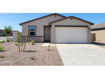 Charming single-story home featuring a neutral color palette, two-car garage, and low-maintenance landscaping at 3557 E Audrey Dr, San Tan Valley, AZ 85143