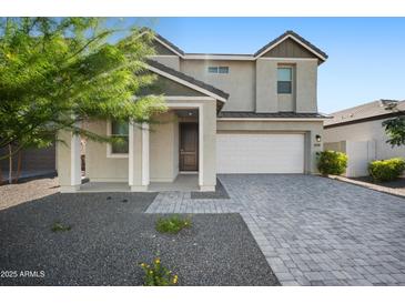 Charming two-story home featuring a two-car garage, a well-maintained front yard, and a welcoming entrance at 4615 S 23Rd Way, Phoenix, AZ 85040