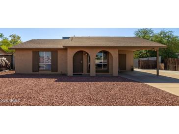 Charming single-story home with arched entryway and desert landscaping for low maintenance at 4624 S Fair Ln, Tempe, AZ 85282
