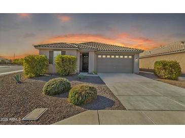 Inviting single-story home with a well-maintained landscape and neutral-toned facade at 7580 W Darrel Rd, Laveen, AZ 85339