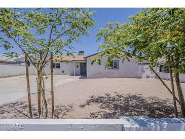 Charming single-story home featuring low maintenance landscaping and an inviting front entrance at 3017 N 46Th Dr, Phoenix, AZ 85031