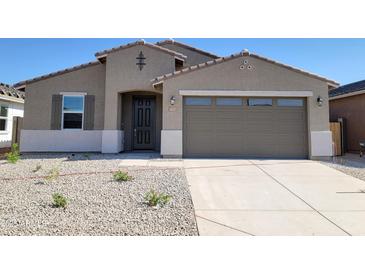 Charming single-story home features a well-kept front yard and a convenient two-car garage, offering comfort and style at 37414 W San Sisto Ave, Maricopa, AZ 85138