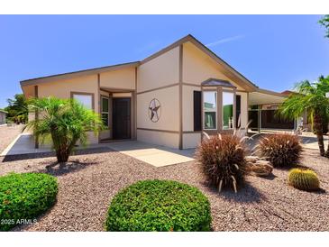 Charming home featuring desert landscaping, a decorative star, and a covered carport at 8500 E Southern Ave # 510, Mesa, AZ 85209