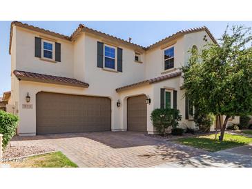 Stunning two-story home with a two-car garage and beautiful brick driveway at 913 W Yosemite Dr, Chandler, AZ 85248