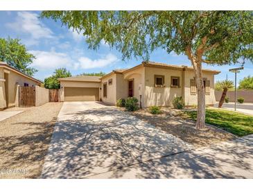 Inviting single-story home with a neutral color scheme, tile roof and desert landscaping at 948 E Savannah Dr, Chandler, AZ 85225