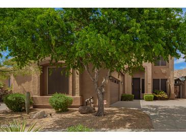 Charming single-Gathering home with a mature shade tree and desert landscaping at 2526 W Florentine Rd, Phoenix, AZ 85086