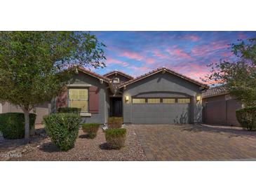 Charming single-Gathering home featuring a well-manicured lawn and a neutral color scheme at 4218 W Palace Station Rd, New River, AZ 85087