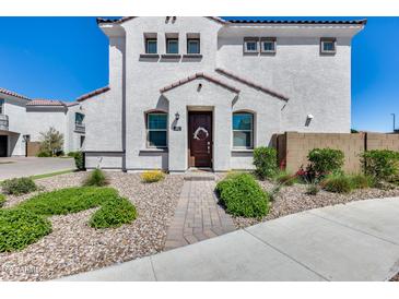 Charming two-story home with a well-manicured front yard and inviting entrance at 651 N Bay Dr, Gilbert, AZ 85233