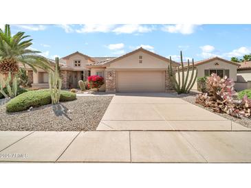 Charming single-Gathering home featuring desert landscaping, a two-car garage and lovely curb appeal at 15534 W Big Sky Dr, Surprise, AZ 85374