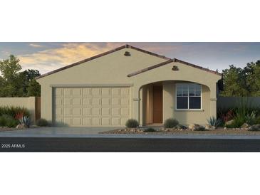 Charming single-story home with a two-car garage and well-manicured landscaping at 17633 W Georgia Ave, Litchfield Park, AZ 85340