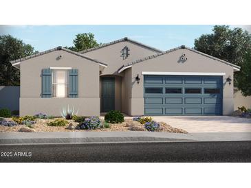Charming single-story home featuring a two-car garage and desert landscaping at 24447 W Grenadine Rd, Buckeye, AZ 85326