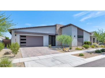 Beautiful single-story home featuring a modern design, desert landscaping, and a two-car garage at 812 E Summerside Rd, Phoenix, AZ 85042