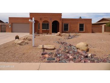 Charming single-story brick home with a desert-landscaped yard and a welcoming front entry at 3726 W Campo Bello Dr, Glendale, AZ 85308