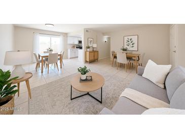 Bright living room featuring a dining area and modern furnishings at 8023 N 49Th Ave, Glendale, AZ 85302
