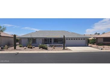 Charming single-story home featuring desert landscaping with rocks and cacti in a well-maintained front yard at 11513 E Lobo Ave, Mesa, AZ 85209