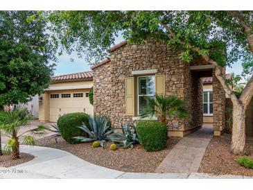 Charming stone home with manicured landscaping and desert landscaping at 4519 N 29Th Way, Phoenix, AZ 85016