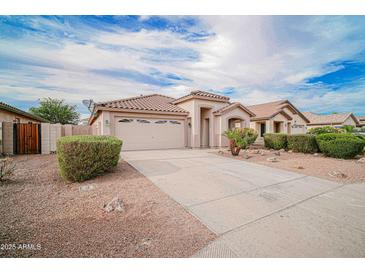 Charming home featuring a tile roof, neutral stucco, and a spacious two-car garage at 636 E Redondo Dr, Gilbert, AZ 85296