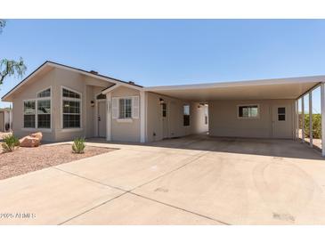 Inviting home with a covered carport and well-maintained landscaping offers curb appeal at 8500 E Southern Ave # 550, Mesa, AZ 85209