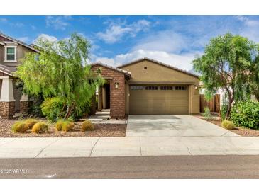 Charming single-story home featuring a desert landscape and a convenient two-car garage at 9222 W Roma Ave, Phoenix, AZ 85037