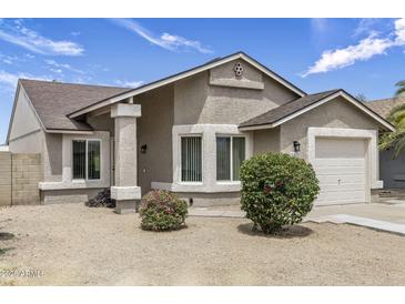 Charming single-story home featuring a low maintenance yard and attached one car garage at 20428 N 32Nd Ln, Phoenix, AZ 85027