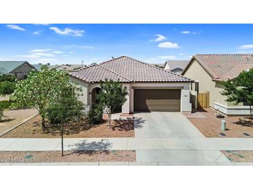 Charming single-story home with a tile roof, a two-car garage, and desert landscaping at 21104 E Poco Calle --, Queen Creek, AZ 85142
