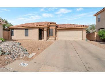 Charming single-story home featuring a well-maintained yard and a spacious two-car garage at 2366 E Spruce Dr, Chandler, AZ 85286