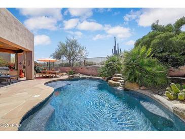 Sparkling backyard pool with desert landscaping and seating area with mountain views at 27892 N 108Th Way, Scottsdale, AZ 85262