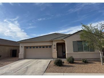 Charming one-story home with a two car garage and low-maintenance landscaping at 21544 W Watkins St, Buckeye, AZ 85326