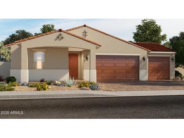 Charming single-story home featuring a tile roof, a two-car garage, and desert landscaping at 17661 W Mariposa Dr, Goodyear, AZ 85395