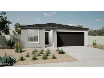 Charming single-story home featuring a gray stucco finish, a black garage door, and desert landscaping at 17969 W Sand Hills Rd, Surprise, AZ 85387