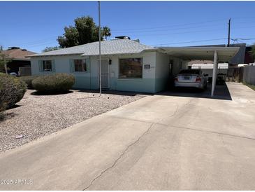 Charming single-story home featuring a carport and low-maintenance landscaping in a quiet neighborhood at 2937 W Marshall Ave, Phoenix, AZ 85017