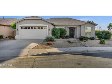 Charming single-story home featuring a two car garage and low maintenance desert landscaping at 3640 E Torrey Pines Ln, Chandler, AZ 85249