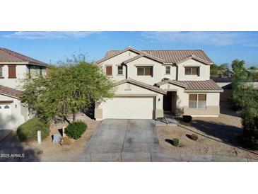 Charming two-story home showcasing a well-manicured yard and welcoming two-car garage at 4804 S 25Th Dr, Phoenix, AZ 85041