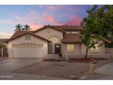 Charming single-Gathering home featuring a classic tile roof and a well-maintained front yard at 845 N Oak Ct, Chandler, AZ 85226