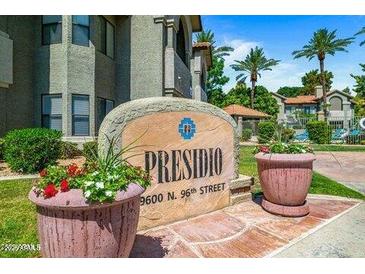 Welcoming community sign with lush landscaping in front of the Presidio residences at 9600 N. 96th Street at 9600 N 96Th St # 263, Scottsdale, AZ 85258