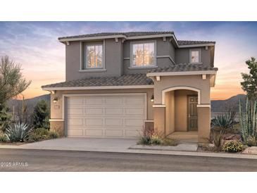 Charming two-story home with a neutral color palette and well-manicured landscaping, presenting an inviting curb appeal at 17608 W San Juan Ave, Litchfield Park, AZ 85340