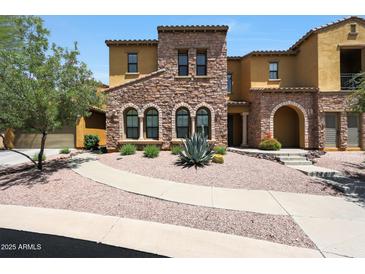 Charming two-story home with desert landscaping and a stone facade at 20750 N 87Th St # 2062, Scottsdale, AZ 85255