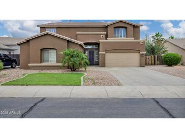 Stunning two-story home with a two-car garage and desert landscaping at 4647 E County Down Dr, Chandler, AZ 85249