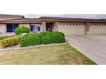 Charming single story home with a two-car garage and well maintained landscaping at 11069 E Kilarea Ave # 194, Mesa, AZ 85209