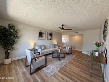 Inviting living room featuring neutral tones, modern furnishings, and stylish decor for a comfortable living space at 2337 E Manhatton Dr, Tempe, AZ 85282