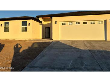 Charming single-story home with neutral stucco, a 2-car garage, and a concrete driveway at 3627 W Palmaire Ave, Phoenix, AZ 85051