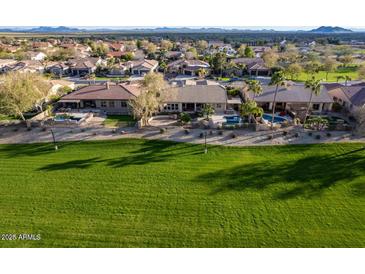 Beautiful homes backing onto a lush green golf course, offering scenic views and a peaceful setting at 654 E County Down Dr, Chandler, AZ 85249